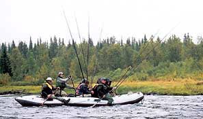 Here is a a group of salmon fishermens down the river in a inflatable boat. This fishmethod is called drifting in Sweden.