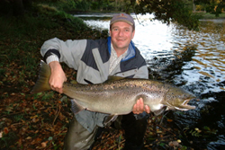 Martin from Stockholm with a large salmon weight 12kg, taken at Em.