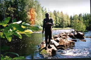 Sven Holmström inspect the river in 1994 before habitat measures just below the bridge at Bursjöns outlet
